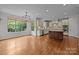 Eat-in kitchen with granite countertops, stainless steel appliances, and a large window for natural light at 3206 Lakehurst Xing, Matthews, NC 28104