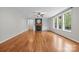 Bright living room featuring hardwood floors, a fireplace, and lots of natural light at 3206 Lakehurst Xing, Matthews, NC 28104