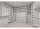 Spacious walk-in closet with custom shelving and storage solutions featuring drawers, shelves, and hanging rods at 3206 Lakehurst Xing, Matthews, NC 28104