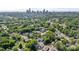 A scenic aerial view of the city skyline and surrounding neighborhood with lush green trees at 331 Solomon St, Charlotte, NC 28216