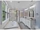 Modern bathroom with double vanity, bathtub, and glass-enclosed shower at 331 Solomon St, Charlotte, NC 28216
