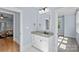 Bathroom featuring a white vanity with granite countertop and hexagon tile flooring at 331 Solomon St, Charlotte, NC 28216
