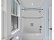 White tiled tub and shower combination with a black shower head fixture at 331 Solomon St, Charlotte, NC 28216