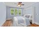 Stylized bedroom with large windows and a fold-down Murphy bed at 331 Solomon St, Charlotte, NC 28216