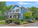 Beautiful blue two-story home with manicured landscaping and a classic architectural design at 331 Solomon St, Charlotte, NC 28216
