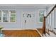 Elegant foyer featuring hardwood floors, staircase, and natural light from surrounding windows at 331 Solomon St, Charlotte, NC 28216