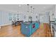 Open kitchen featuring a large island with seating, modern appliances, and ample dining space at 331 Solomon St, Charlotte, NC 28216