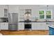 Modern kitchen design featuring stainless steel appliances and white cabinets at 331 Solomon St, Charlotte, NC 28216