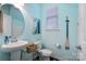 Charming powder room with unique nautical decor, pedestal sink, and bright turquoise walls at 344 Linestowe Dr, Belmont, NC 28012