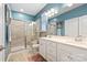 Luxurious bathroom with glass-enclosed shower, double vanity, and neutral tile at 344 Linestowe Dr, Belmont, NC 28012