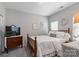 Cozy bedroom featuring a full-sized bed, wood dresser, and neutral decor at 344 Linestowe Dr, Belmont, NC 28012