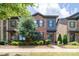 Attractive brick townhouse with modern architectural details, manicured landscaping, and inviting curb appeal at 344 Linestowe Dr, Belmont, NC 28012