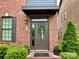 Inviting brick home featuring a stylish front door with a decorative wreath and charming curb appeal at 344 Linestowe Dr, Belmont, NC 28012