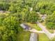 Aerial view of a home in a wooded neighborhood with lush greenery at 405 N Woodland Dr, Lancaster, SC 29720