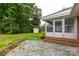 View of the porch and lush backyard with storage shed at 405 N Woodland Dr, Lancaster, SC 29720