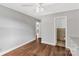 Bedroom with hardwood floors, painted gray walls, and a ceiling fan at 405 N Woodland Dr, Lancaster, SC 29720