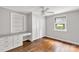 Bedroom with built-in storage and desk area, with hardwood floors offering versatility at 405 N Woodland Dr, Lancaster, SC 29720