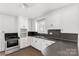 Charming kitchen featuring white cabinets and modern appliances at 405 N Woodland Dr, Lancaster, SC 29720