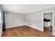 A bright living room featuring hardwood floors, neutral walls, and natural light at 405 N Woodland Dr, Lancaster, SC 29720