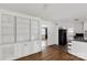 Bright living room featuring hardwood floors and built-in shelving at 405 N Woodland Dr, Lancaster, SC 29720