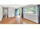 Bright room with a large window and hardwood floors, creating a welcoming and open space at 405 N Woodland Dr, Lancaster, SC 29720