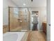 Bathroom featuring a soaking tub and a tiled shower at 4095 Harmattan Dr, Denver, NC 28037