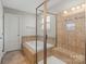 Bathroom featuring a soaking tub and a tiled shower at 4095 Harmattan Dr, Denver, NC 28037
