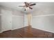 Spacious bedroom with gleaming wood floors and neutral paint at 4095 Harmattan Dr, Denver, NC 28037