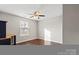 Bright bedroom with wood floors, ceiling fan, and a window at 4095 Harmattan Dr, Denver, NC 28037