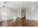 Spacious room with hardwood floors, recessed lighting, neutral walls, and white trim and doors throughout at 4095 Harmattan Dr, Denver, NC 28037