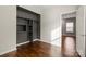 A closet features dark shelving and wood flooring at 4095 Harmattan Dr, Denver, NC 28037