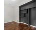 A closet features dark shelving and wood flooring at 4095 Harmattan Dr, Denver, NC 28037