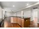 A gourmet kitchen boasts a large island, open to the living room with beautiful hardwood floors at 4095 Harmattan Dr, Denver, NC 28037