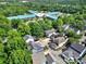 Aerial view showcasing a vibrant community with mature trees, diverse housing, and a nearby school at 436 Third Baxter St, Fort Mill, SC 29708