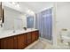 Bathroom featuring a dual sink vanity, framed mirror, and tiled floors that add style to the space at 436 Third Baxter St, Fort Mill, SC 29708