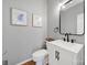Half bathroom featuring a modern vanity with black fixtures and decor with a neutral color palette at 436 Third Baxter St, Fort Mill, SC 29708