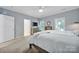 Light-filled bedroom featuring neutral walls, plush carpeting, and a ceiling fan for added comfort at 436 Third Baxter St, Fort Mill, SC 29708