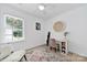 Cozy bedroom with a neutral-toned rug, desk, and ample natural light, perfect for relaxation or study at 436 Third Baxter St, Fort Mill, SC 29708
