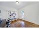 Bright room with hardwood floors, built-in shelving and a view of the outside at 436 Third Baxter St, Fort Mill, SC 29708