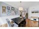 Inviting dining room with dark wood table, gallery wall and lots of natural light at 436 Third Baxter St, Fort Mill, SC 29708