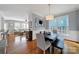 Open-concept dining area with hardwood floors, lots of natural light and modern furnishings at 436 Third Baxter St, Fort Mill, SC 29708