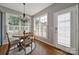 Bright dining room featuring natural light, modern chandelier, and seating for four guests at 436 Third Baxter St, Fort Mill, SC 29708