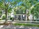 Beautiful two-story home featuring a welcoming front porch, classic white picket fence, and mature trees at 436 Third Baxter St, Fort Mill, SC 29708