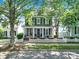 Charming two-story home boasting a classic design, inviting front porch, and well-maintained landscaping at 436 Third Baxter St, Fort Mill, SC 29708