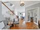 Bright foyer with hardwood floors, staircase, and access to dining and living areas at 436 Third Baxter St, Fort Mill, SC 29708