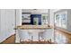 Kitchen showcasing breakfast bar with seating, a gold faucet, white subway tiles, and blue cabinets at 436 Third Baxter St, Fort Mill, SC 29708