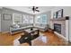 Cozy living room featuring a large sectional sofa, fireplace and hardwood floors at 436 Third Baxter St, Fort Mill, SC 29708
