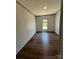 Bedroom with hardwood floors and natural light from the window at 493 Eagle Mills Rd, Hamptonville, NC 27020