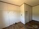 This closet features shelving, modern flooring and a neutral color palette at 493 Eagle Mills Rd, Hamptonville, NC 27020