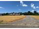 Charming single-story home with a manicured lawn and a long gravel driveway at 493 Eagle Mills Rd, Hamptonville, NC 27020